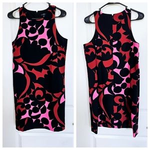 A floral midi dress sleeveless design With combination of black, red  pink
